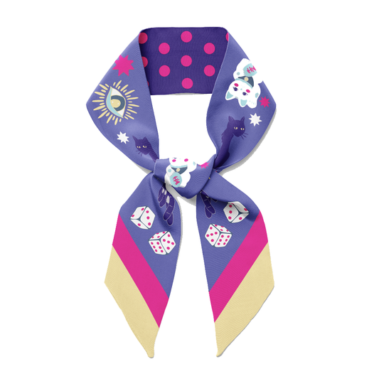 A blue twilly bow ribbon silk scarf with polka dots, lucky cats, stars and dice on it.