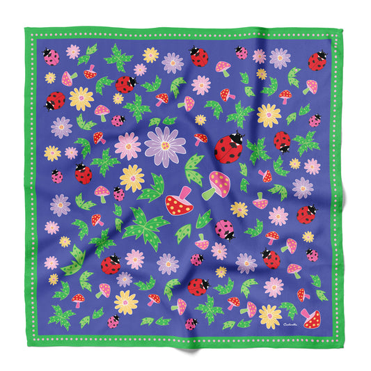 Cotton and silk blend bandana with ladybugs and flowers and mushrooms with a green border.