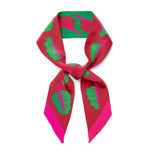 A twilly bow ribbon silk scarf with green chard and red back with neon pink details
