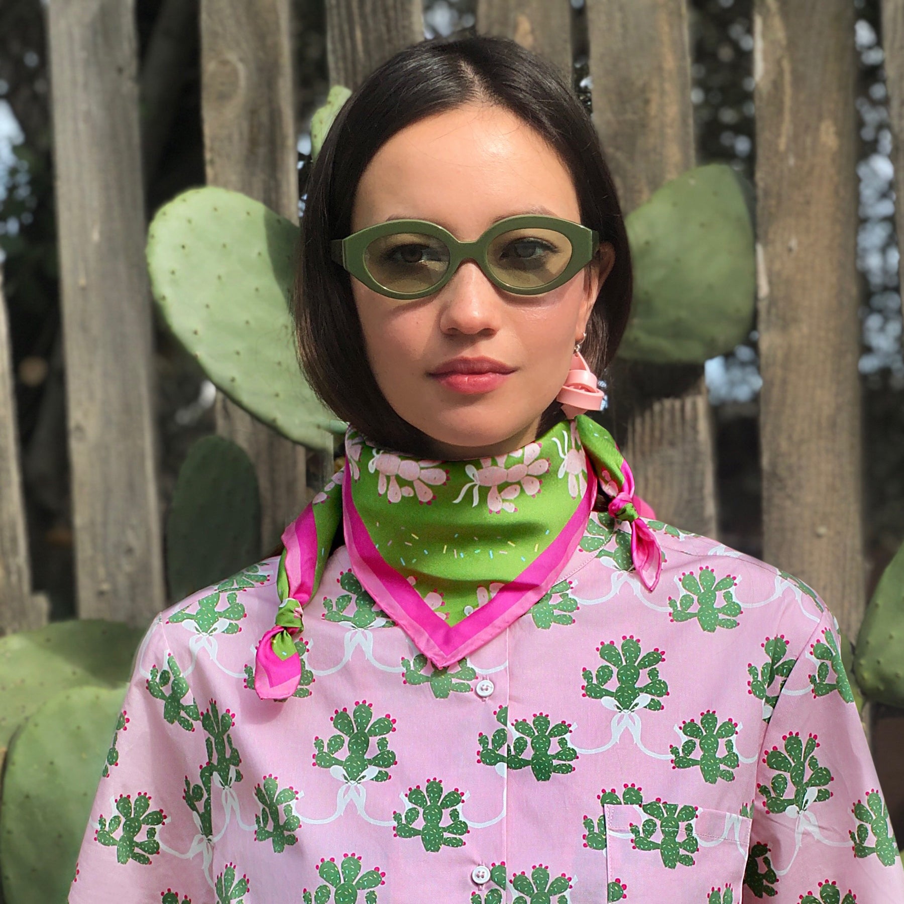 Set of green silk scarf with cacti and pink shirt with green cacti.