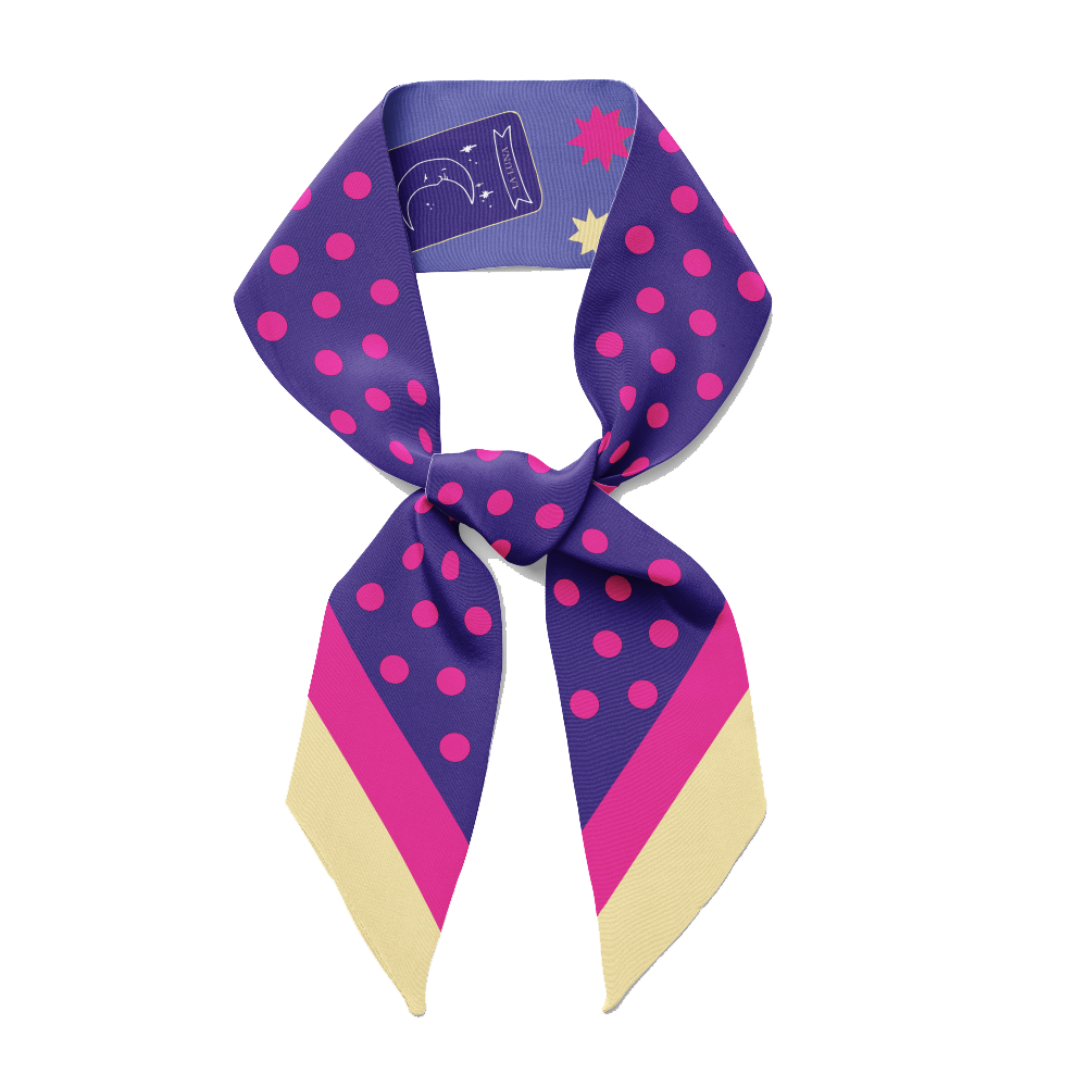 A blue twilly bow ribbon silk scarf with pink polka dots lucky cat, charms and stars on it.