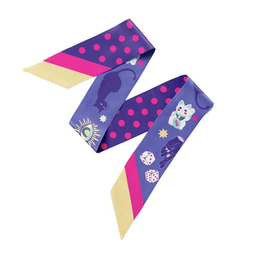 A blue twilly bow ribbon silk scarf with pink polka, dots lucky cat, charms and stars on it.