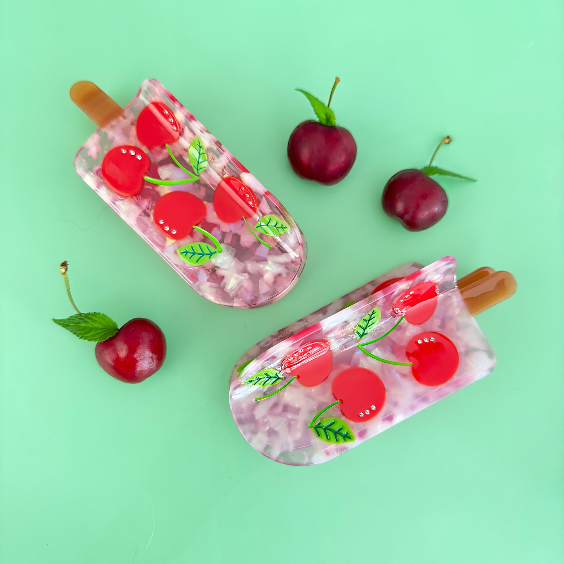 Keep it cool with our Cherry popsicle hair claw, with red cherries with crystals and pink translucent cellulose acetate