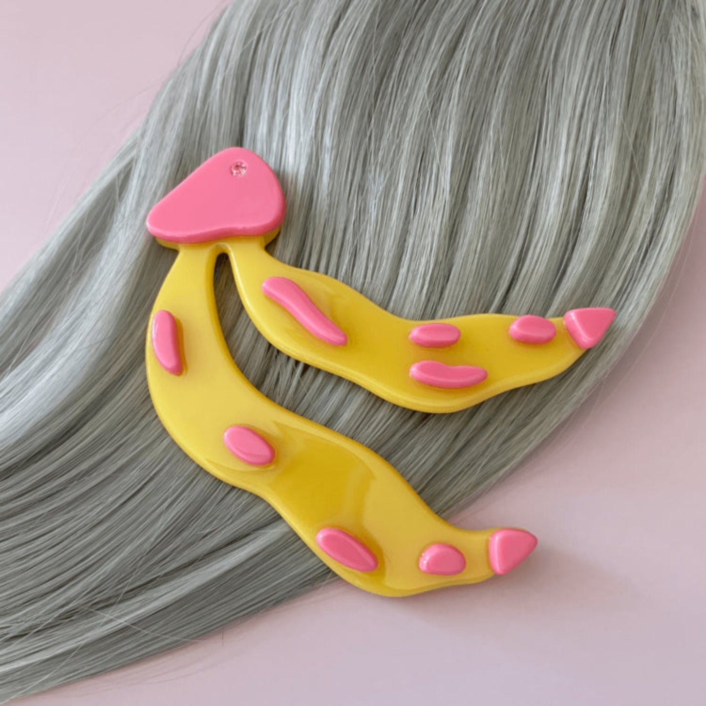 Bananas hair clip on silver hair.