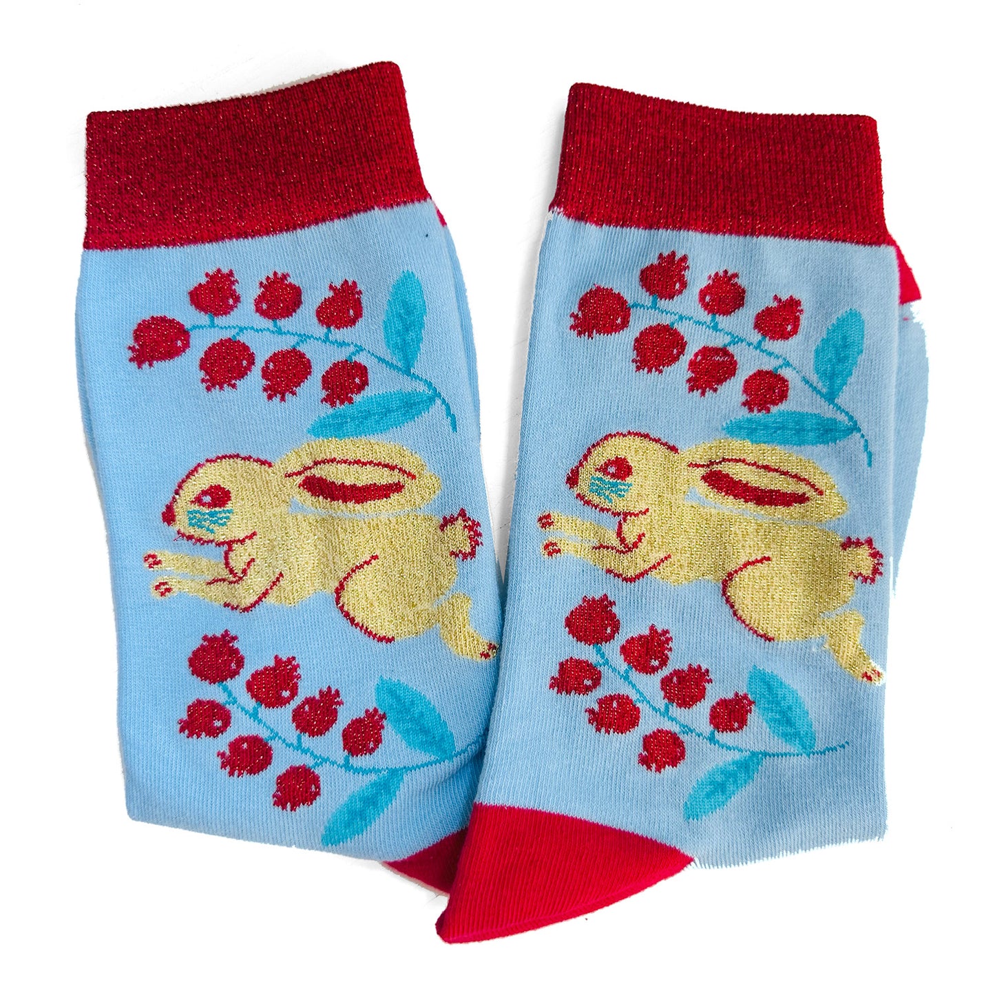 A pair of blue and red socks with rabbits on them.