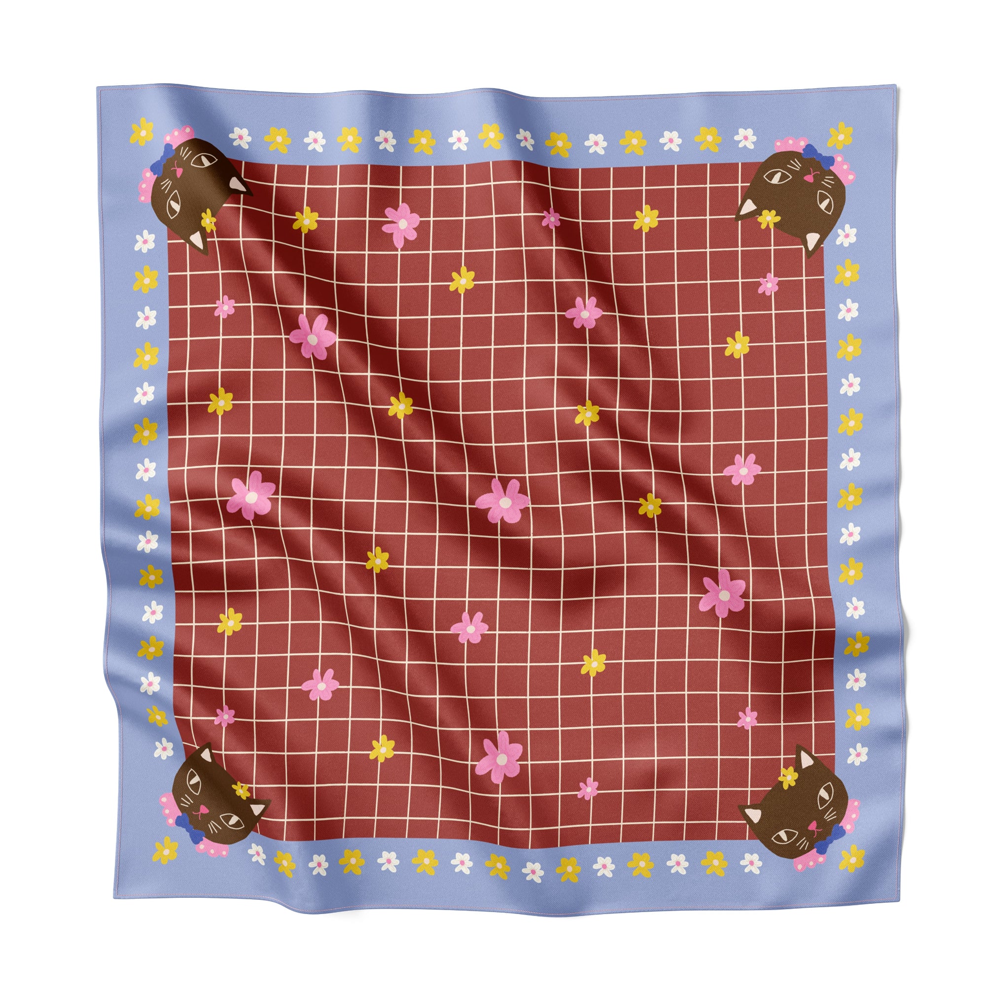 Fabric square with grid pattern, animal shapes, and flowers on a white background
