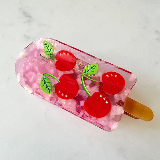 Keep it cool with our Cherry popsicle hair claw, with red cherries with crystals and pink translucent cellulose acetate