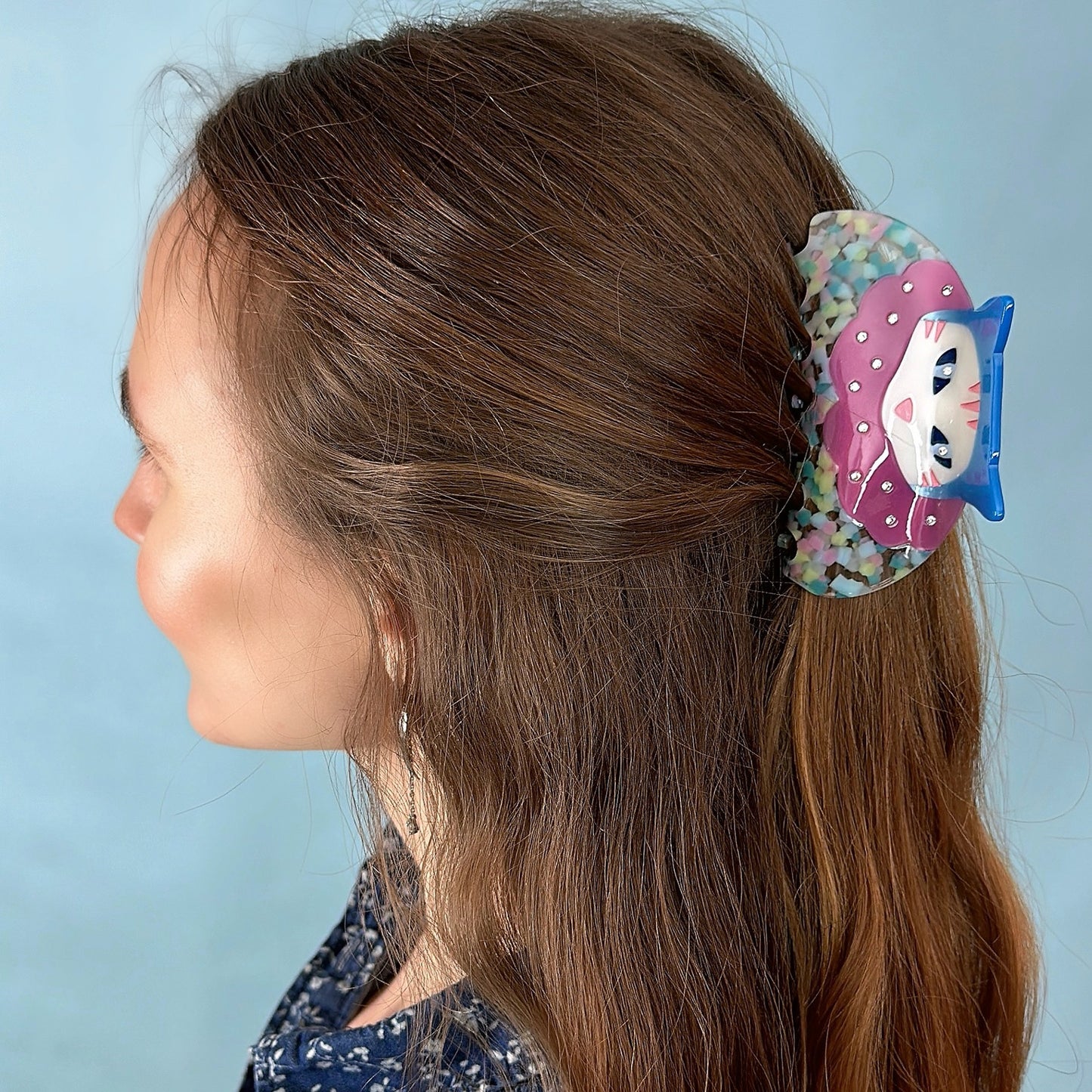 Confetti cat clown hair claw with pink and blue acetate on model hairstyle