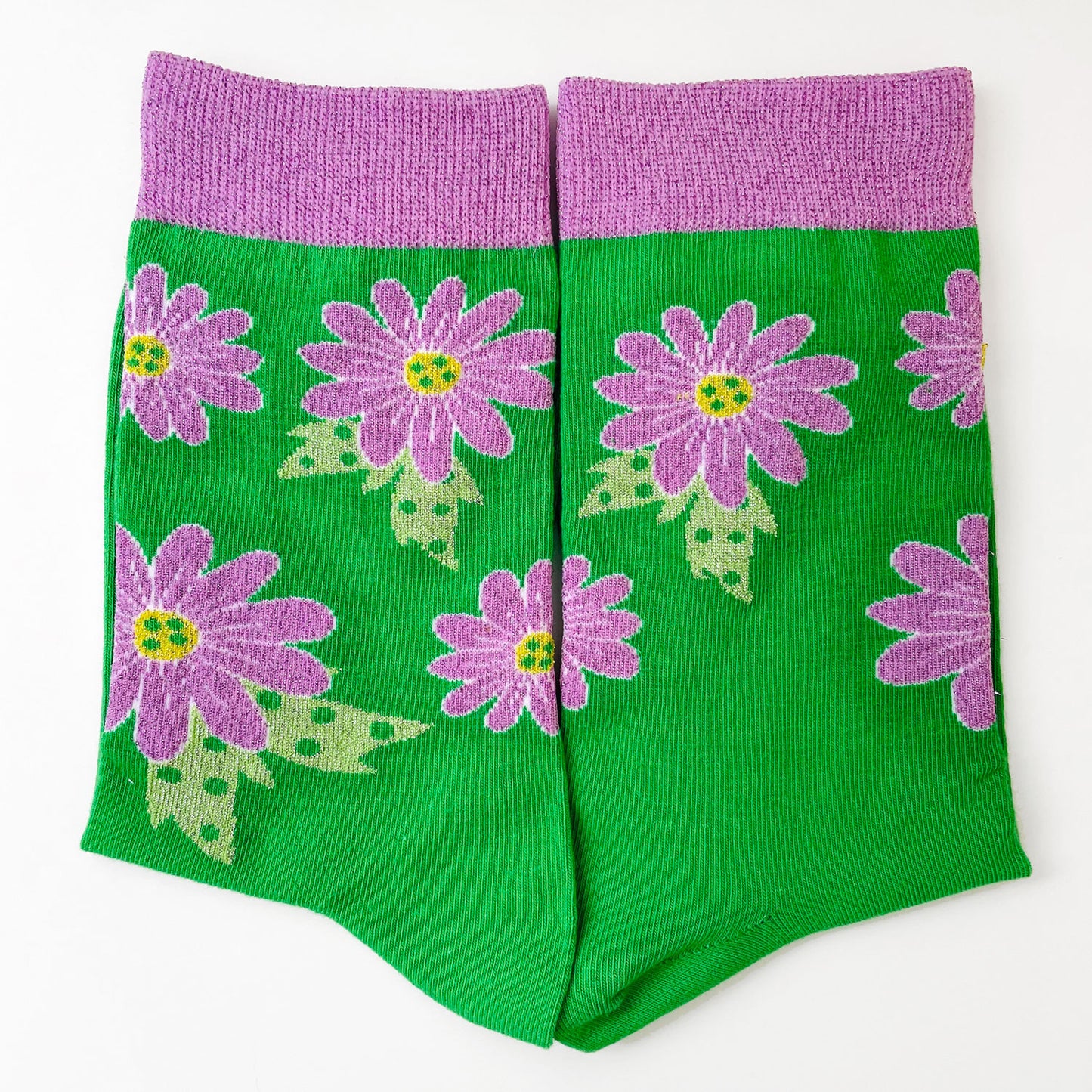 Green sock with purple flowers in cotton with mettalic yarn details