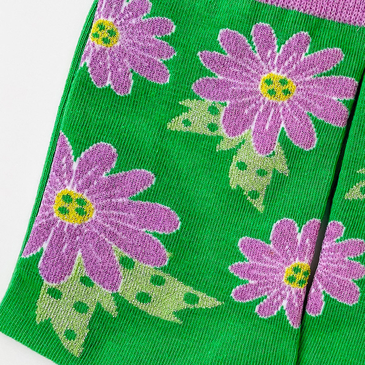Green socks with purple flowers.