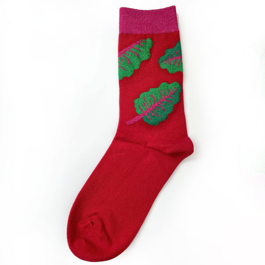 Green chard on red red sock.