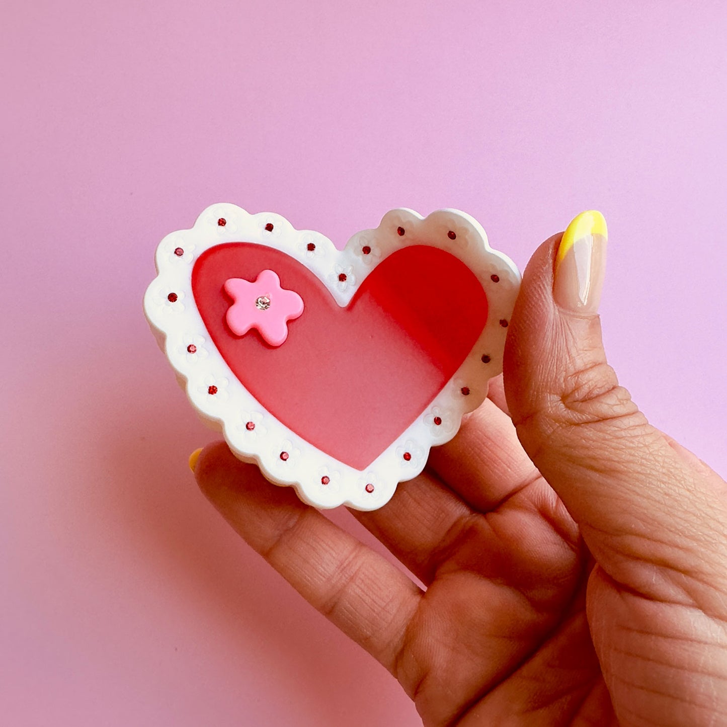 Be my valentine with this cellulose acetate Laced Heart Hair Claw on mate finish