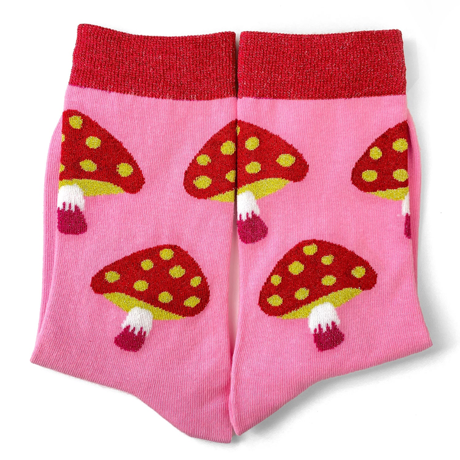 Pink and red socks with mushrooms.