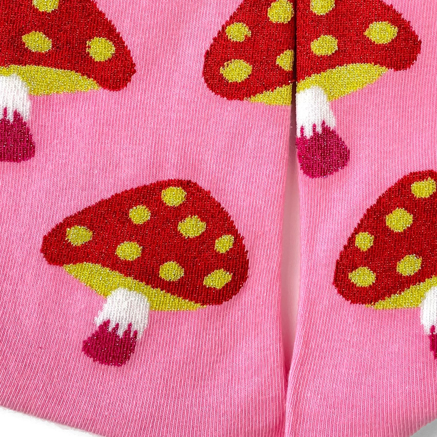 Red mushrooms on pink socks.