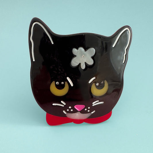 black cat hair clip with flower