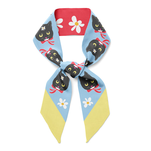 Black cats on. a blue and yellow twill silk scarf.