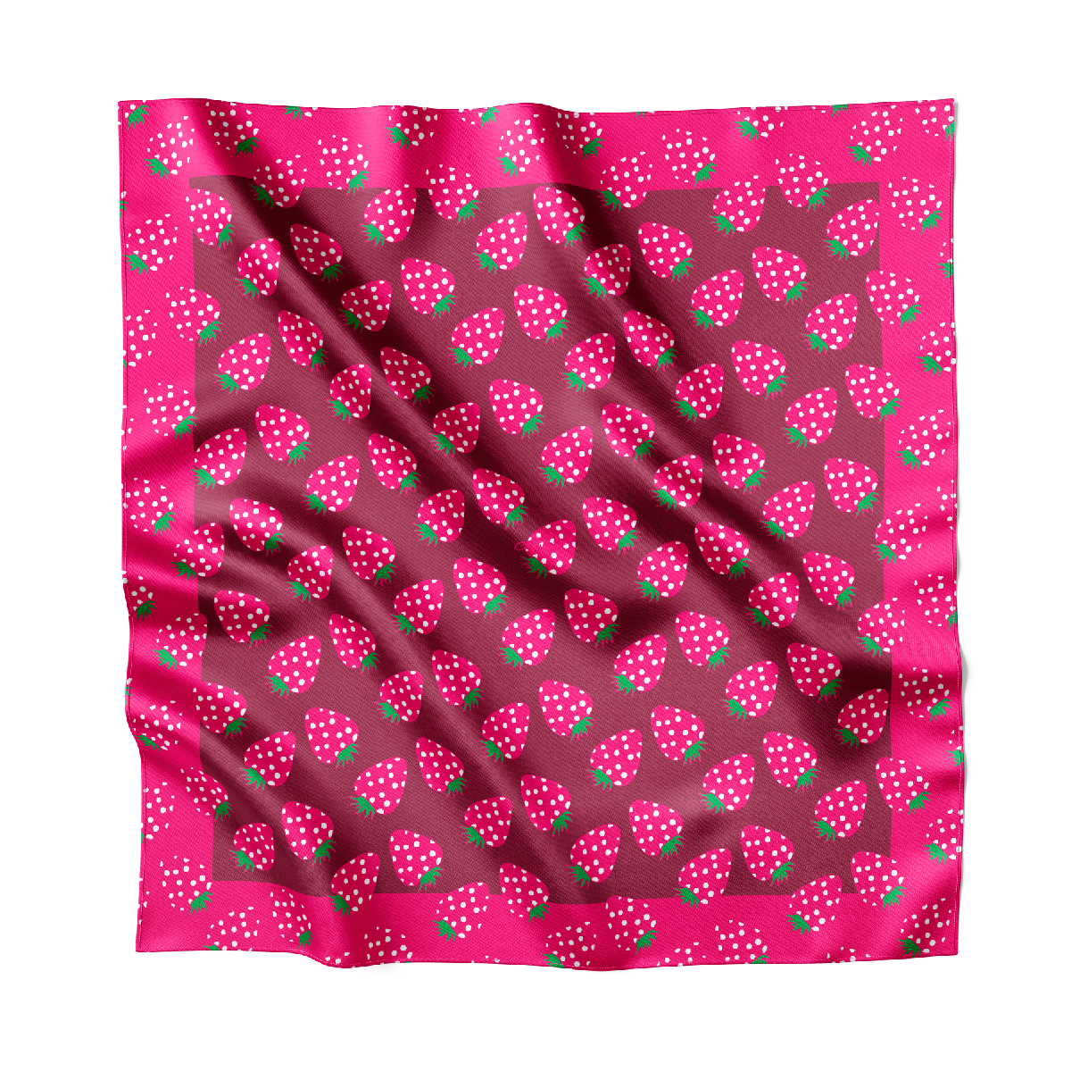 A pink silk scarf with strawberries on it.