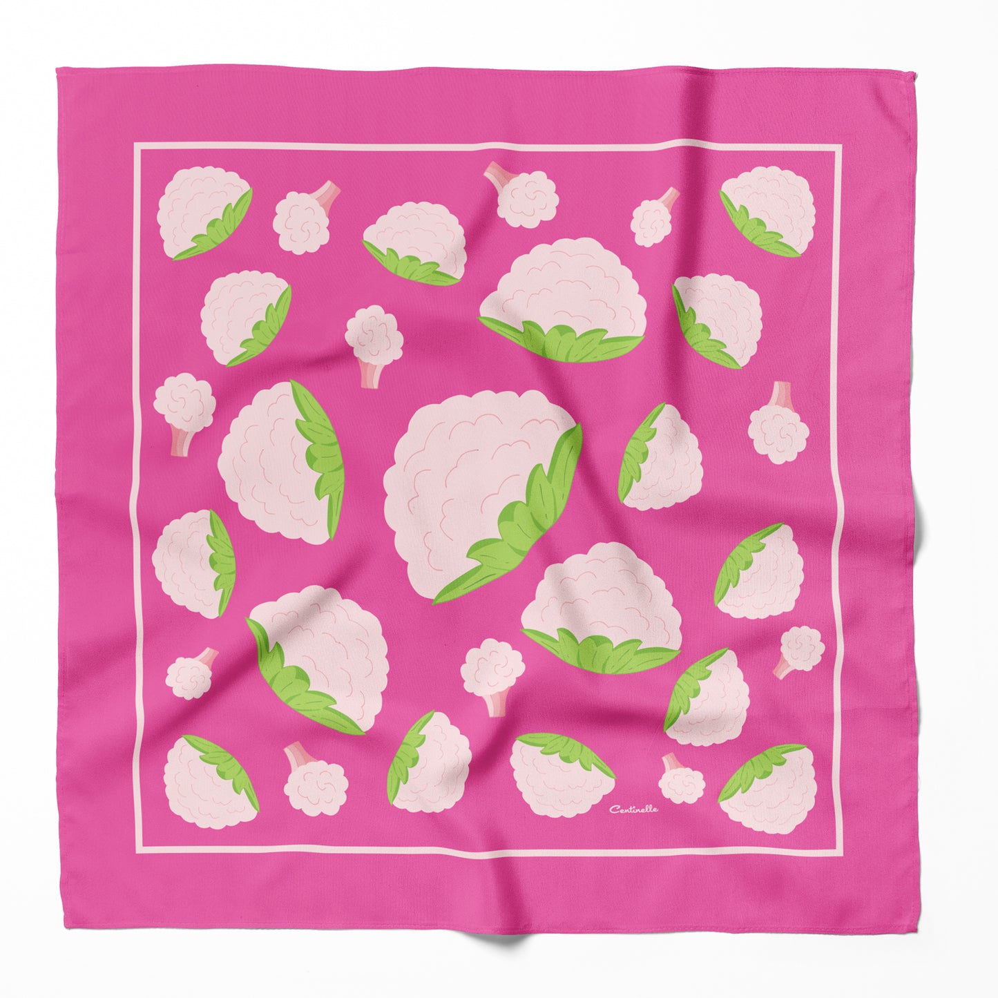 Multiple cauliflower on a pink silk bandana.