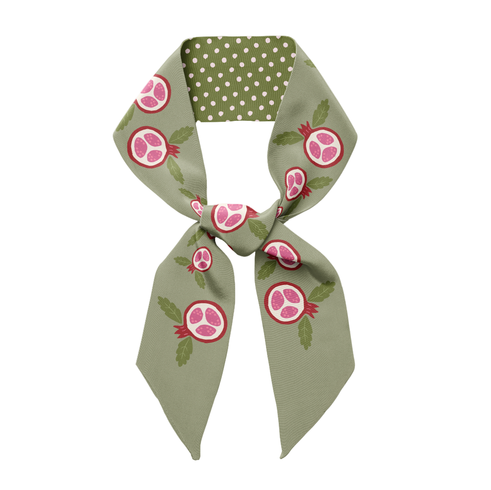 Green scarf with pomegranate pattern on a white background