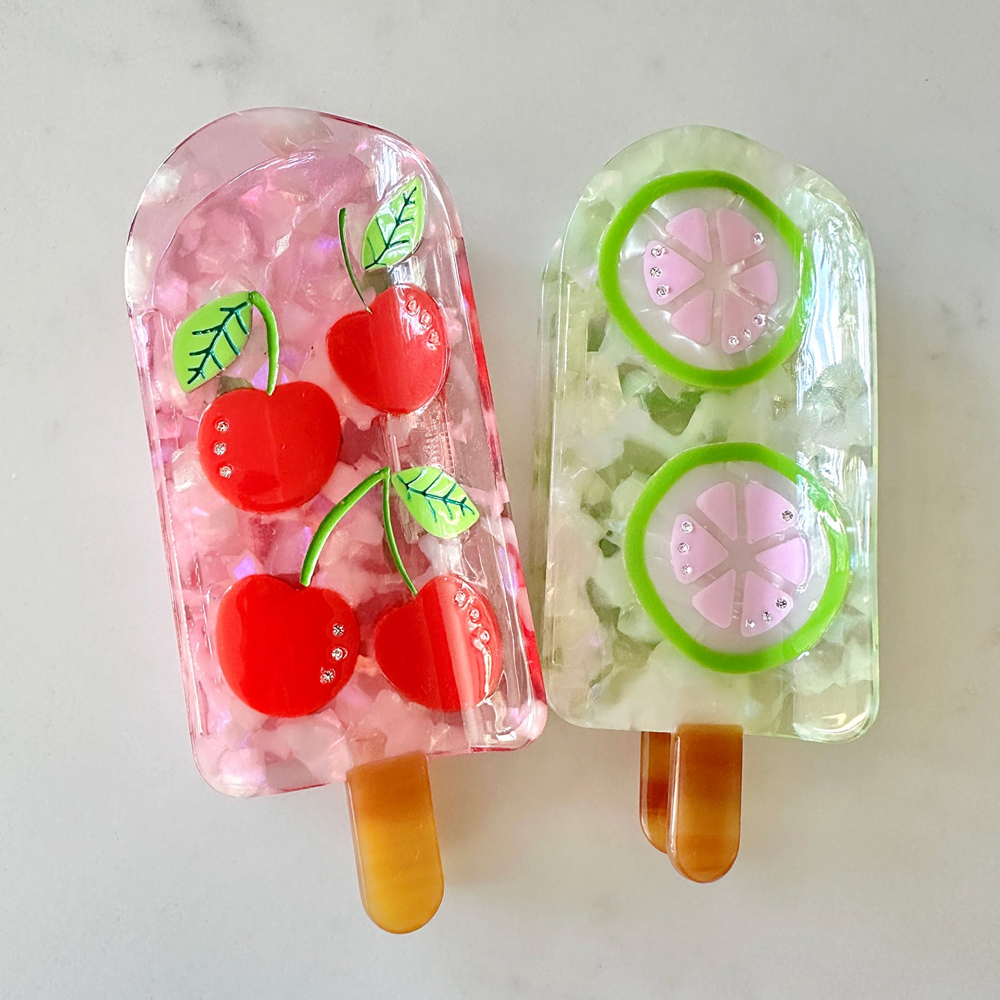 Keep it cool with our Cherry and Pink lemon popsicle hair claw with crystals and pink translucent cellulose acetate