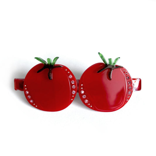 A red tomato hair barrette.